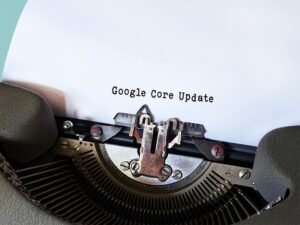 Close-up of a typewriter typing 'Google Core Update' on paper, symbolizing digital advancement.